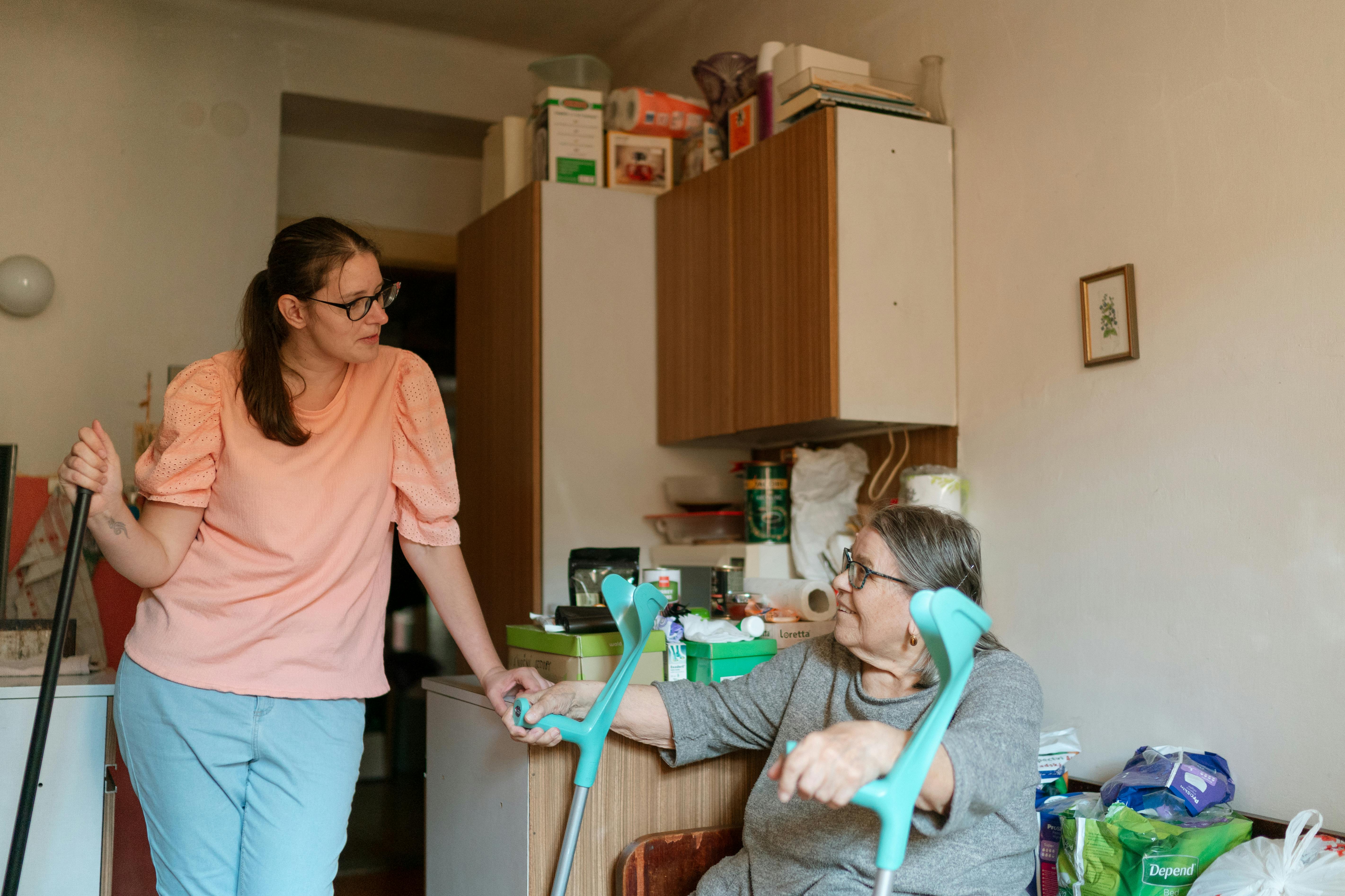 Caregiver speaking with client at home